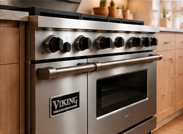 Professional stainless-steel gas range with black control knobs